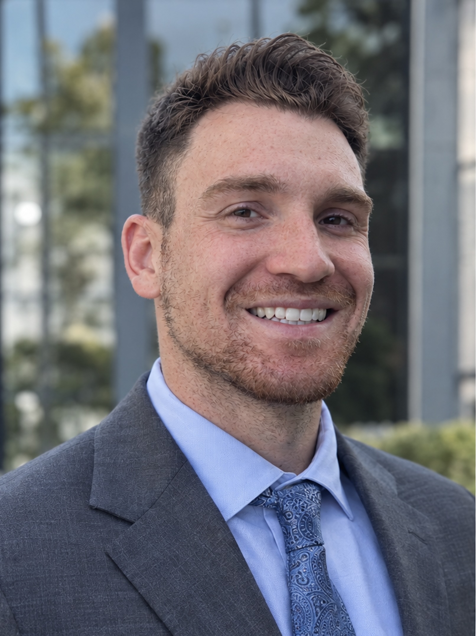 Joseph Schummer in a suit and tie